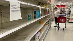 A woman shops for baby formula as shortage continues in US.