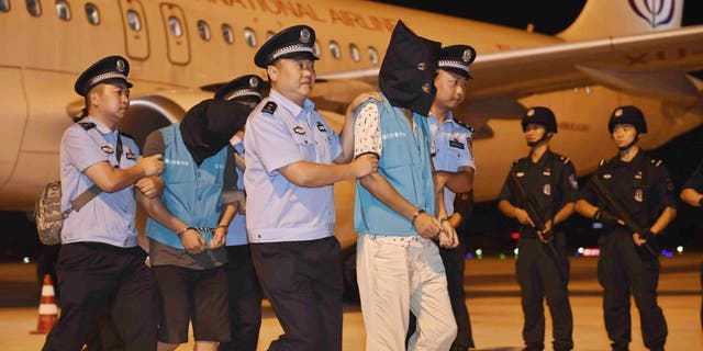Suspects in telecoms scams are brought back to China from Cambodia as the CCP cracks down on fraud committed by its citizens overseas.