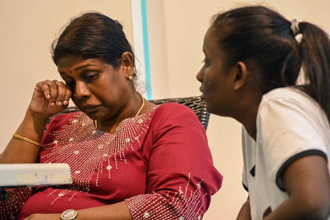 Leelavathy Suppiah (L), sister of a convicted drug trafficker Tangaraju Suppiah, reacts during a press conference in Singapore on April 23, 2023.  Suppiah was hanged on April 25, 2023 after being convicted of trafficking one kilogram of cannabis.