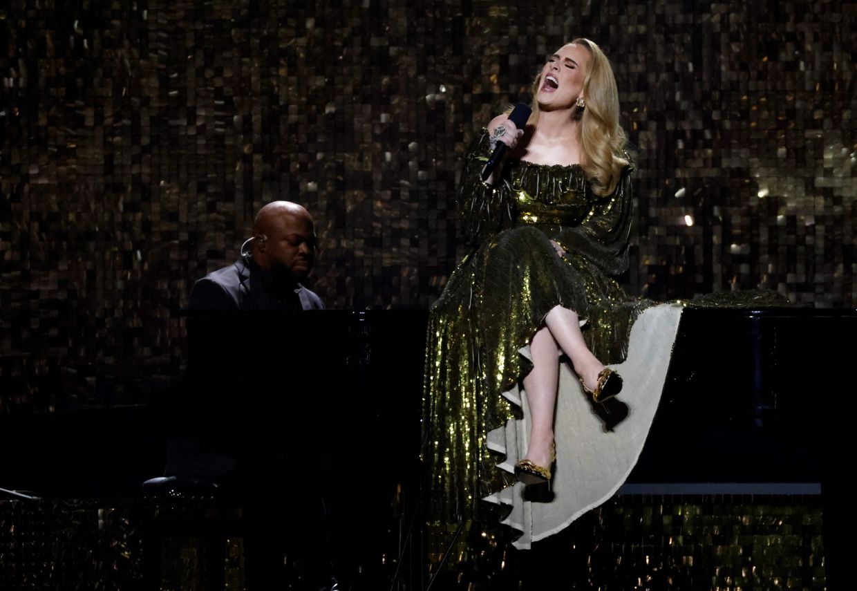 Hello? Don't throw stuff at us, Adele urges fans
