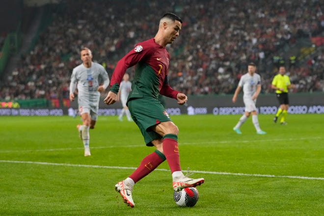 Portugal's Cristiano Ronaldo is in action during the Euro 2024 group J qualifying soccer match between Portugal and Iceland, at the Alvalade Stadium in Lisbon, Sunday, Nov. 19, 2023. (AP Photo/Armando Franca)