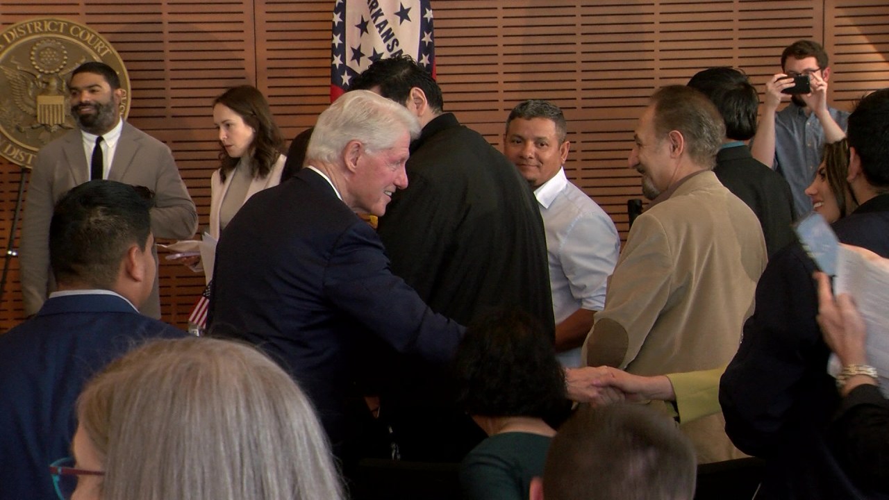 Former President Bill Clinton welcomes new U.S. citizens at naturalization ceremony in Little Rock