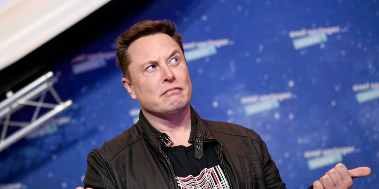 Tesla’s stock is downgraded, more for Elon Musk’s issues than ‘tough’ EV demand