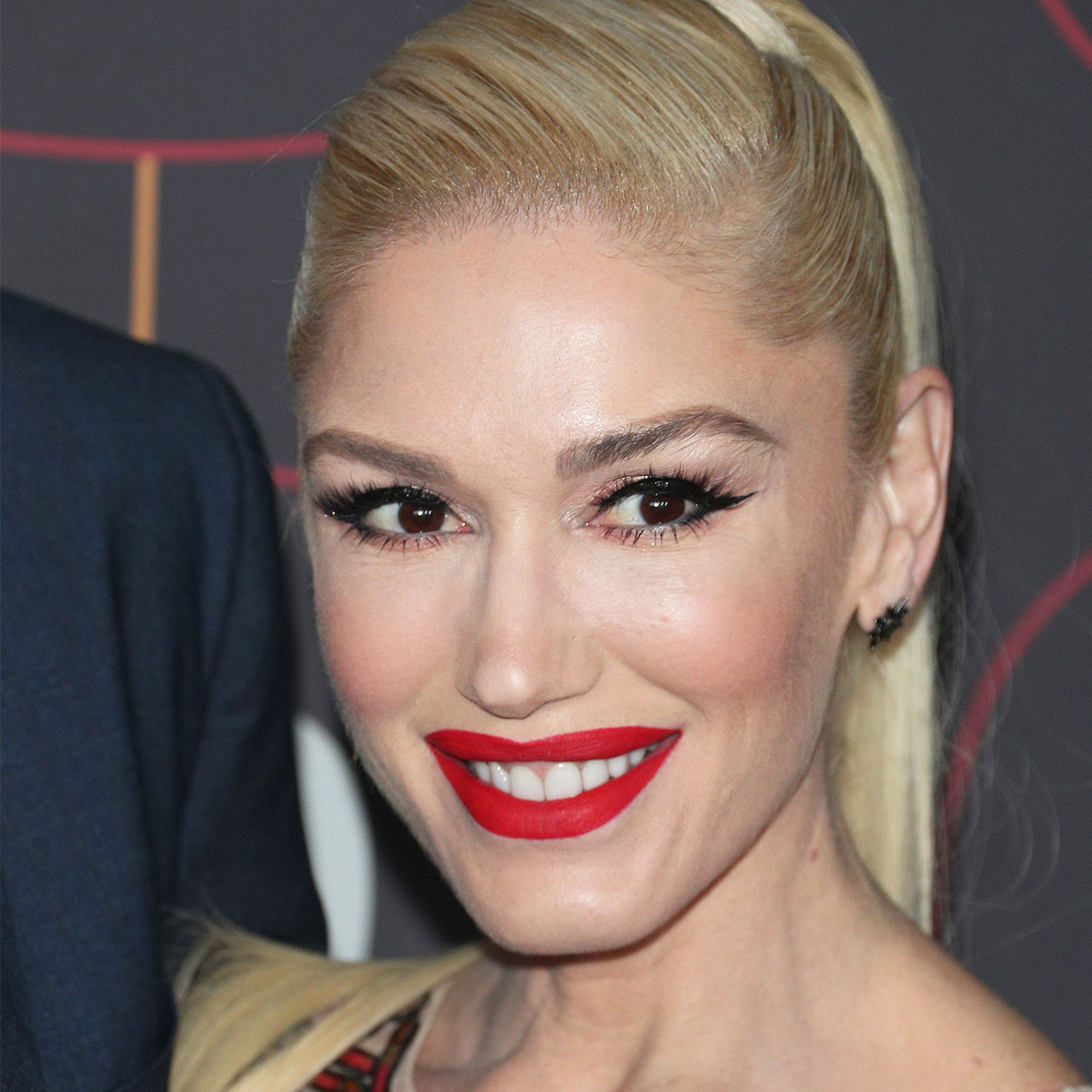 Gwen Stefani Supports Blake Shelton In A Chic Patterned Blazer For Her Husband's Ole Red Bar Opening